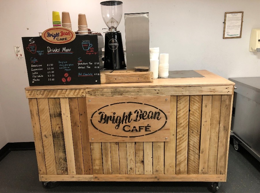 Coffee cart for the Bright Bean cafe showing drinks and coffee machine